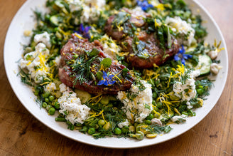 Barbecued Native Breed Pork Steaks with Homemade Ricotta, Cured Courgettes, Peas, Beans, & Herbs.