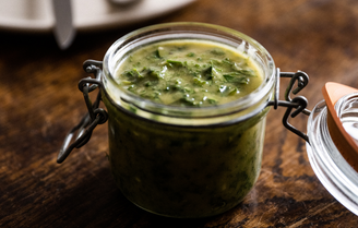 An open jar of homemade chicken fat aioli