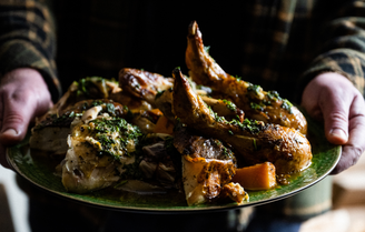 A whole roasted chicken with garlic, shallots, herbs, butternut squash, and treviso chicory.
