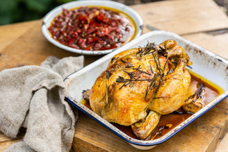 A whole Rosemary & Garlic Roast Chicken with Preserved Lemon & Pilacca