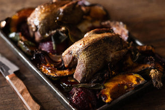Two Roasted Whole Wild Wood Pigeons with Roasted Plums, Pumpkin, Red Onion & Crispy Sage Leaves.
