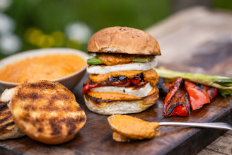 Charred Veg, Halloumi & Romesco Burger with seasonal veggies and artisan cheese.