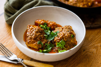 Seafood curry with ling and pollack fish, herbs, coconut milk, and tomatoes.