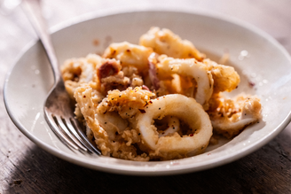 A bowl of Crispy Fried Salt & Pepper Squid.