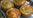 Four cooked pies on a tray