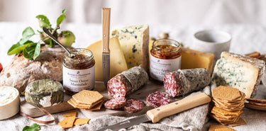 A Spread of Artisan Cheeses, Charcuterie, Small batch Preserves and Crackers, The Perfect Grazing Board for Sharing.