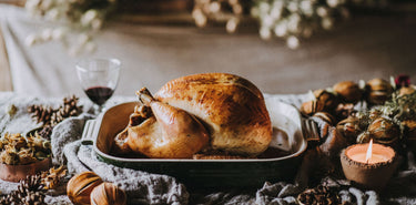 A whole cooked free range turkey on a dinner table