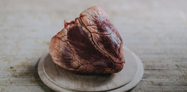 A whole, raw Grass Fed Beef Ox Heart.