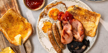 Proper English breakfast Made From Free Range Naturally Cured Bacon, Natural Pork Sausages, Free Range Fried Eggs, Artisan Sourdough and Black Pudding