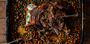 Slow cooked lamb and vegetables in a casserole dish.