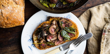 A meal of cooked Grass Fed Lamb Offal on toast with herbs.