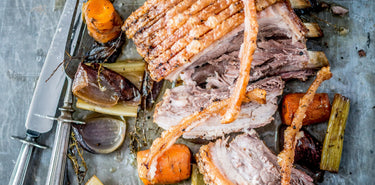 A whole cooked native breed pork belly with apples