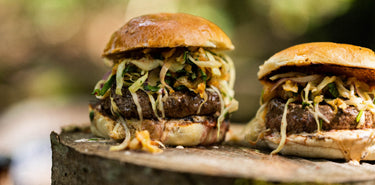 Grass fed beef steak burgers with salad and sauces