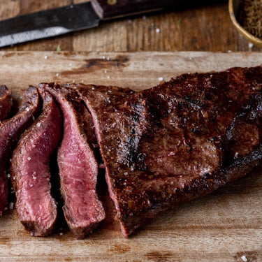 A cooked and sliced grass fed beef steak