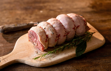 A raw, rolled, properly free range boneless turkey leg