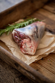 A raw and ready to cook Cull Yaw Mutton Shank with rosemary.