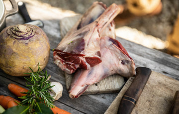 A few raw Cull Yaw Mutton Shanks with vegetables, herbs and garlic.