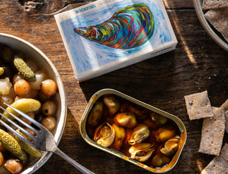 Tinned Mussels in Escabeche Sauce, served with Sourdough Crackers and Preserved pickled Onions and Gherkins.