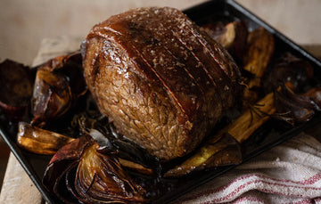 Succulent Cooked Grass-Fed Beef Silverside, Perfectly Roasted To Tender Perfection, Offering A Rich, Savoury Taste For A Delicious Meal.
