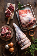 A selection of raw cuts of Cull Yaw Mutton with onions, garlic and herbs.