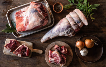 A selection of raw cuts of Cull Yaw Mutton with onions, garlic and herbs,