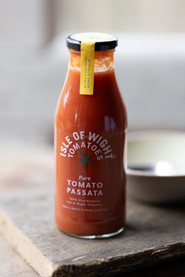 A bottle of pure tomato passata made by the tomato stall