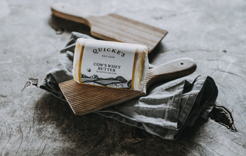 An unopened package of Quicke's grass fed whey butter.