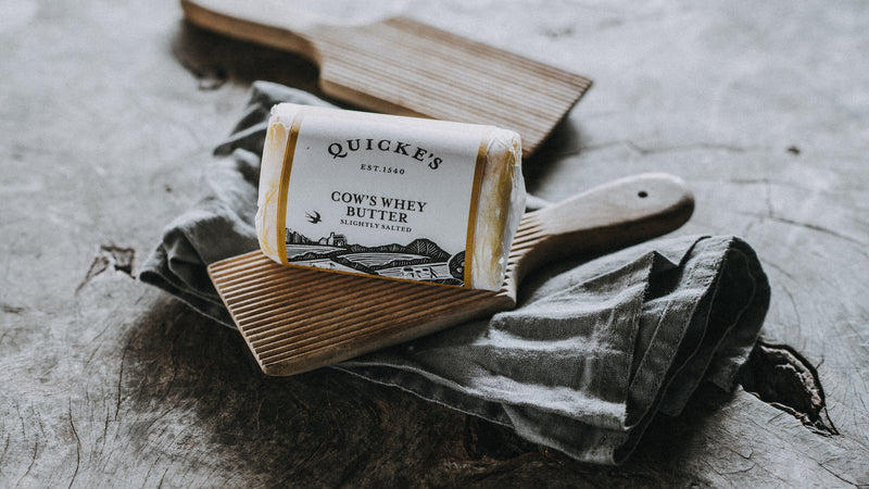 An unopened package of Quicke's grass fed whey butter.
