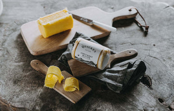 An opened package of Quicke's grass fed whey butter.