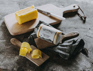 An unopened package of Quicke's grass fed whey butter.