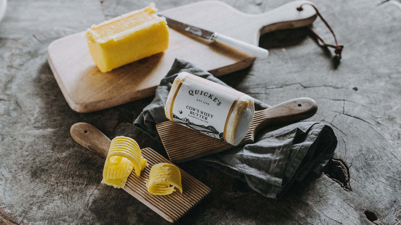 An opened package of Quicke's grass fed whey butter.