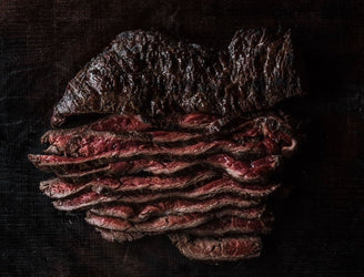 Cooked and sliced, rare, Grass Fed Bavette Steak.