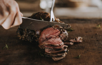 Cooked and sliced Grass Fed Boneless Leg of Lamb