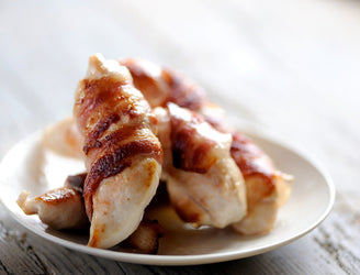Free-range chicken fillets on a wooden board, Perfect for Mid Week Meals.