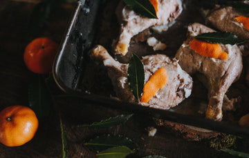 properly free range confit goose legs with bay leaves and orange peel