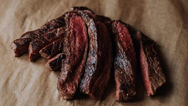 A cooked and sliced grass fed beef everyday steak