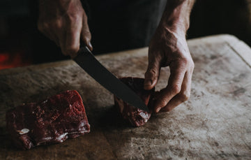 Cutting Raw Grass-Fed Beef Fillet Steaks 