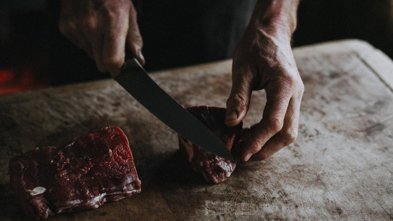 Cutting Raw Grass-Fed Beef Fillet Steaks 