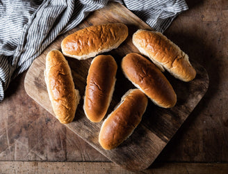A stack of ultimate finger roll buns.