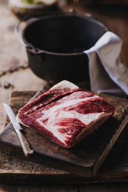 A raw piece of grass fed flat beef brisket.