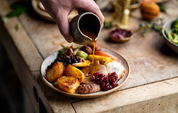A full christmas dinner including turkey, potatoes, and vegetables.