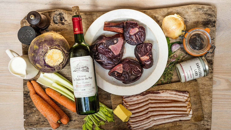 Ingredients for a stew which includes Venison Osso Bucco