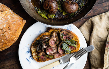 Fresh, uncooked Native Breed Pig's kidneys presented on a plate