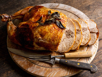 A cooked and sliced properly free range sage & onion stuffed chicken