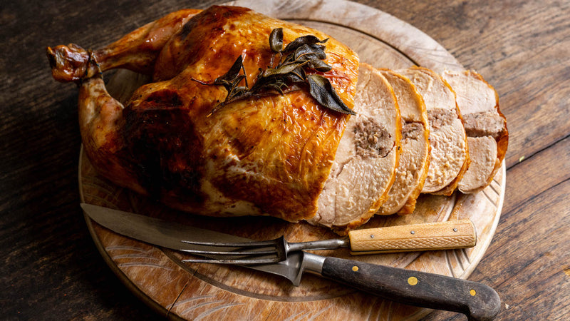 A cooked and sliced properly free range sage & onion stuffed chicken