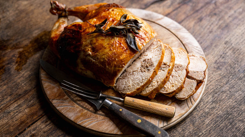 A cooked and sliced properly free range sage & onion stuffed chicken