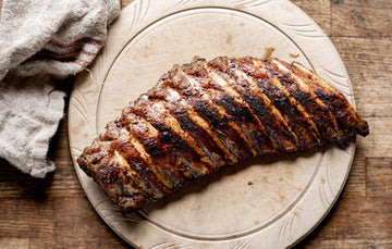 A cooked rack of native breed pork ribs
