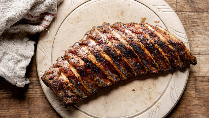 A cooked rack of native breed pork ribs