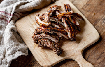 A cooked and sliced rack of native breed pork ribs