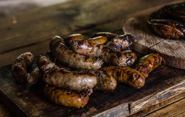 Cooked plain pork native breed pork sausages.